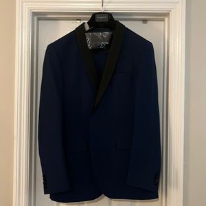 Navy Tuxedo with vest, tie, pocket square, and garment bag